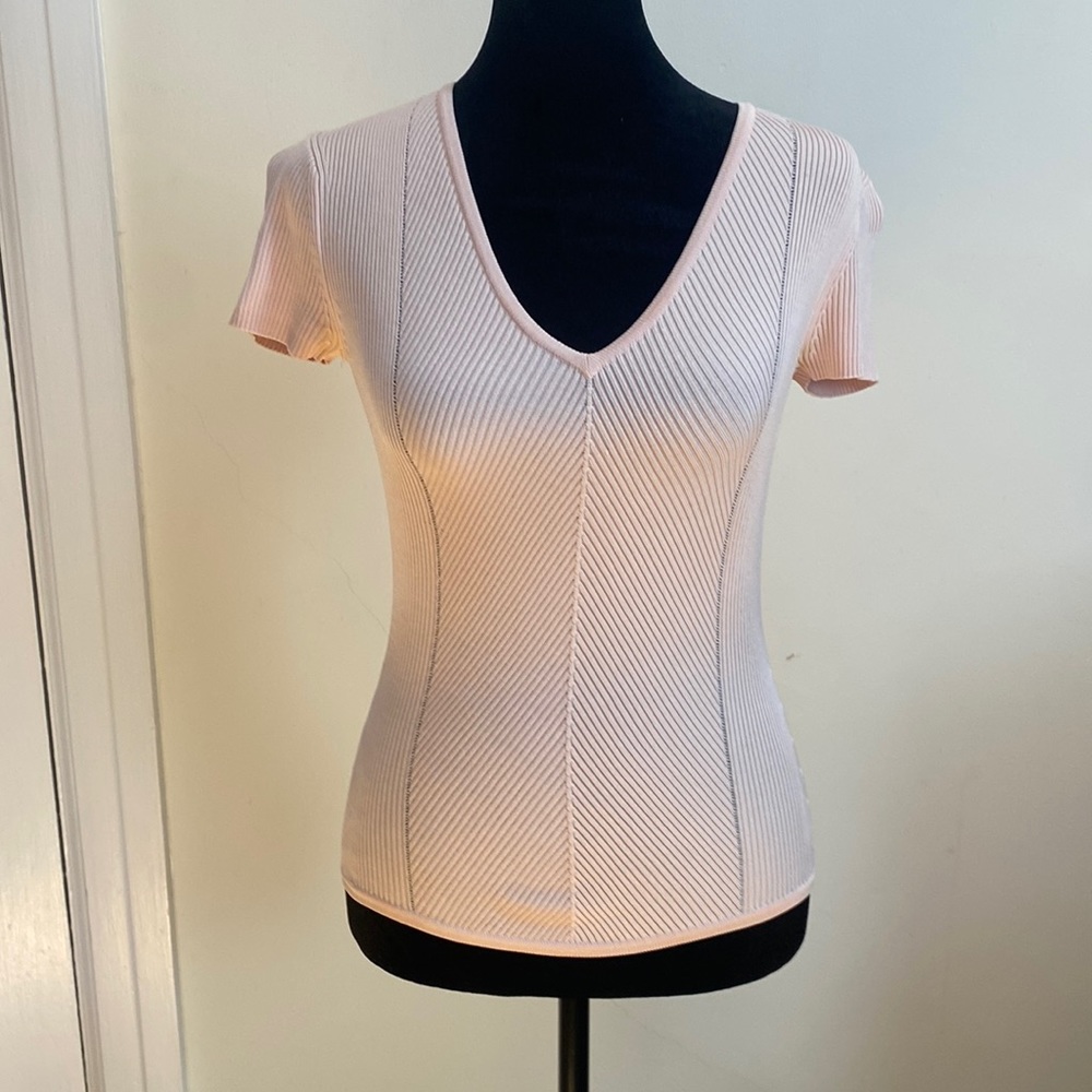Peachy colored form fitting tee. Works great for work or play! Beautiful!